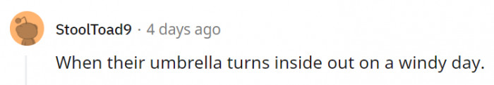 11. When we fold it back the right way, most of us just look angry at the umbrella.