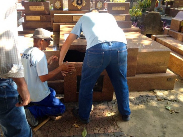 I'm pretty sure even someone who works in a cemetery would be a little freaked out to hear a sound coming from a tomb; why wouldn't your first thought be