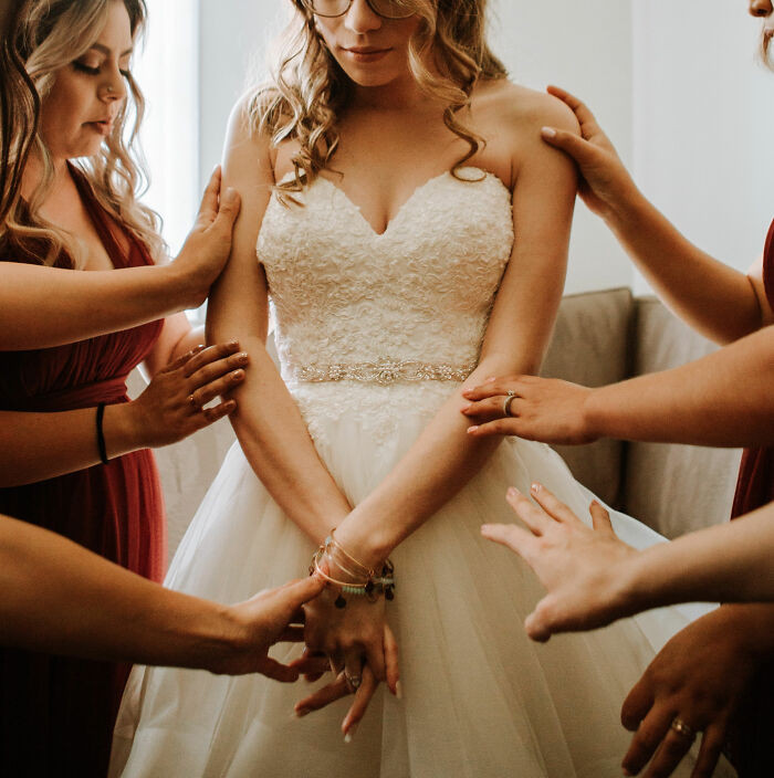 A woman shares her story of how she was accused of upstaging the bride on her wedding day all because she lost weight.