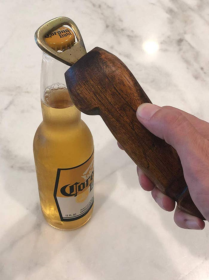 3. A phallic bottle opener so you may open a beer with a ....