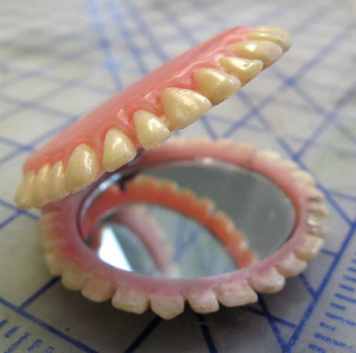 4. A handmade pocket-sized mirror made of dentures is just….