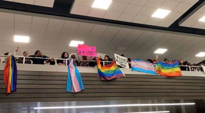The students made banners and brought flags to show support