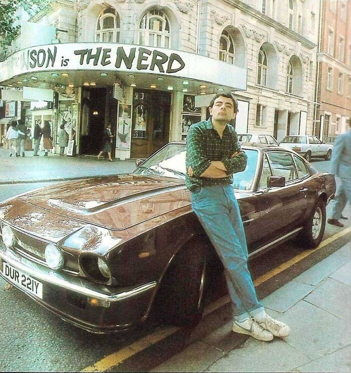 41. Rowan Atkinson Posing With His 1981 Aston Martin Vantage