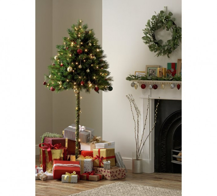 Small half Christmas tree setup, designed to deter a curious cat