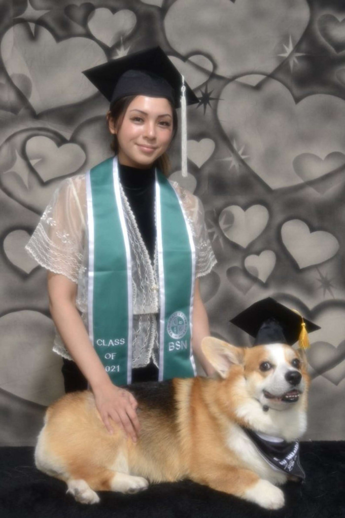 Graduation-themed portrait with student and dog celebrating her achievement