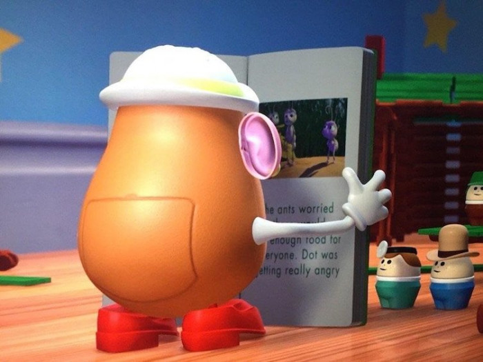 4. Mrs. Potato Head is seen reading a book about A Bug's Life in Toy Story 2.