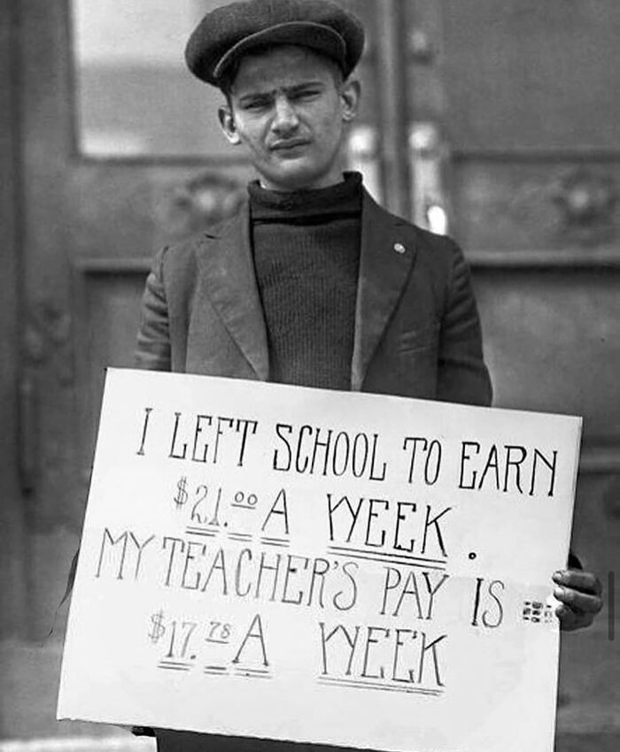 11. A Young Man Protesting Against Low Pay For Teachers In The 1930s