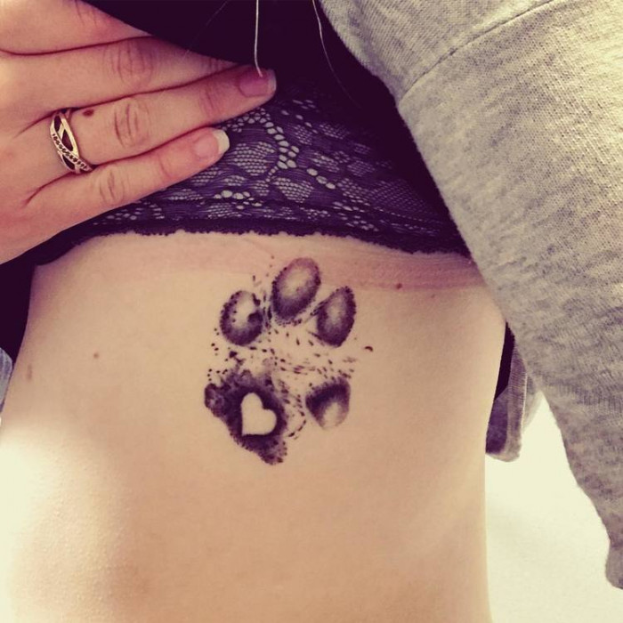 12. Paw tattoo on your side