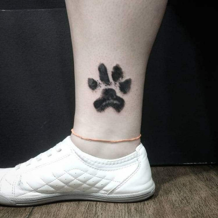 11. Ankle paw tattoo