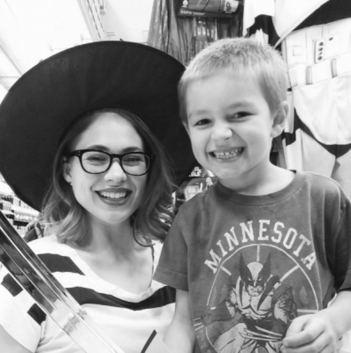 Family-themed cuddle moment, man and cat in cute, over-the-top pose together