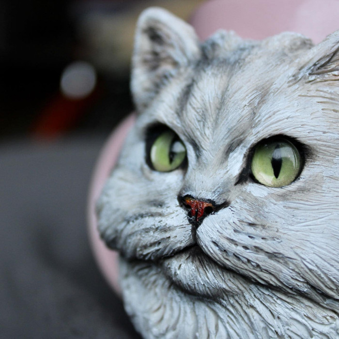 Close-up of custom polymer clay cat mug, meticulous attention to detail and care