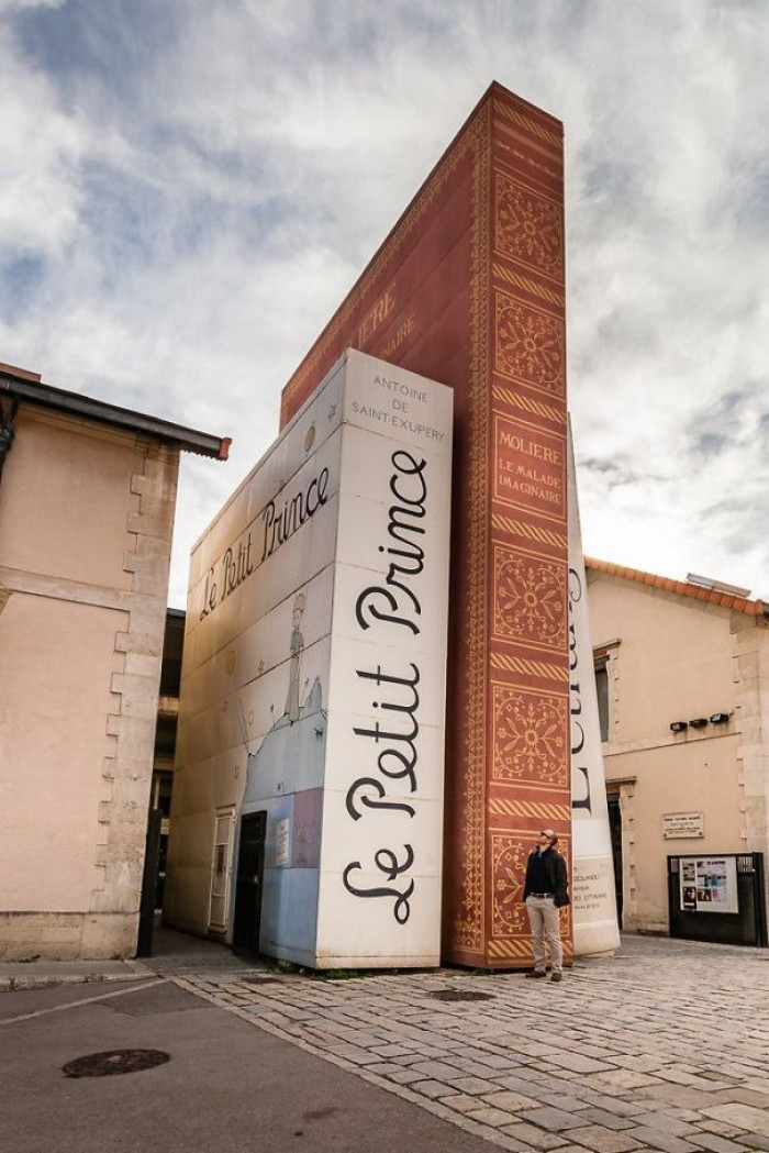 “Gigantic Books At The Entrance Of A Public Library In France”