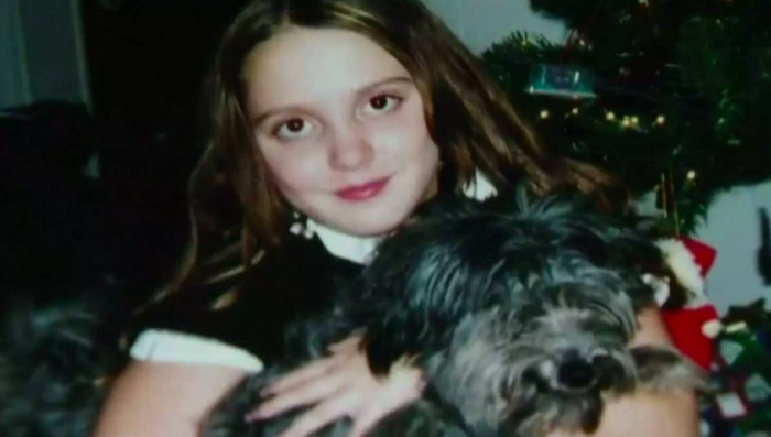 Nicole with Chloe the puppy at around 10 years old.