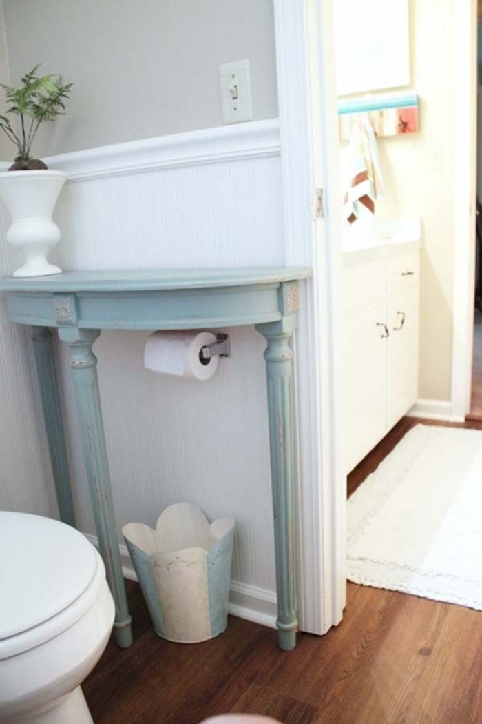 5. Put a slim table in your bathroom to create more space and add a bit more style.