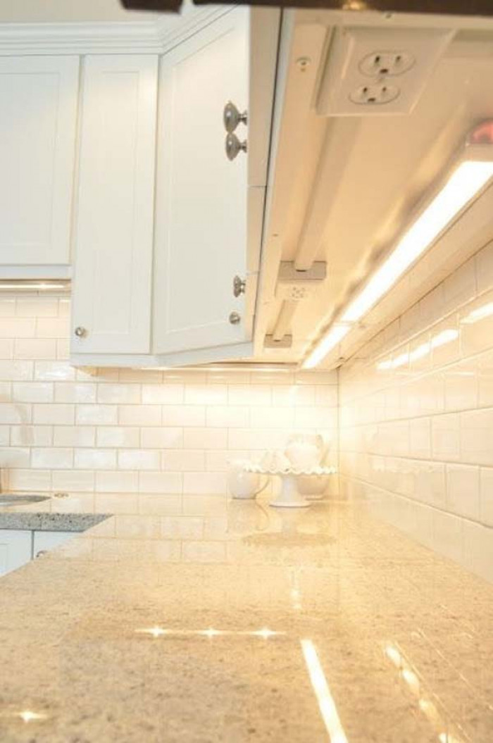 1. Putting outlets under cabinets is also another clever clutter-free option.