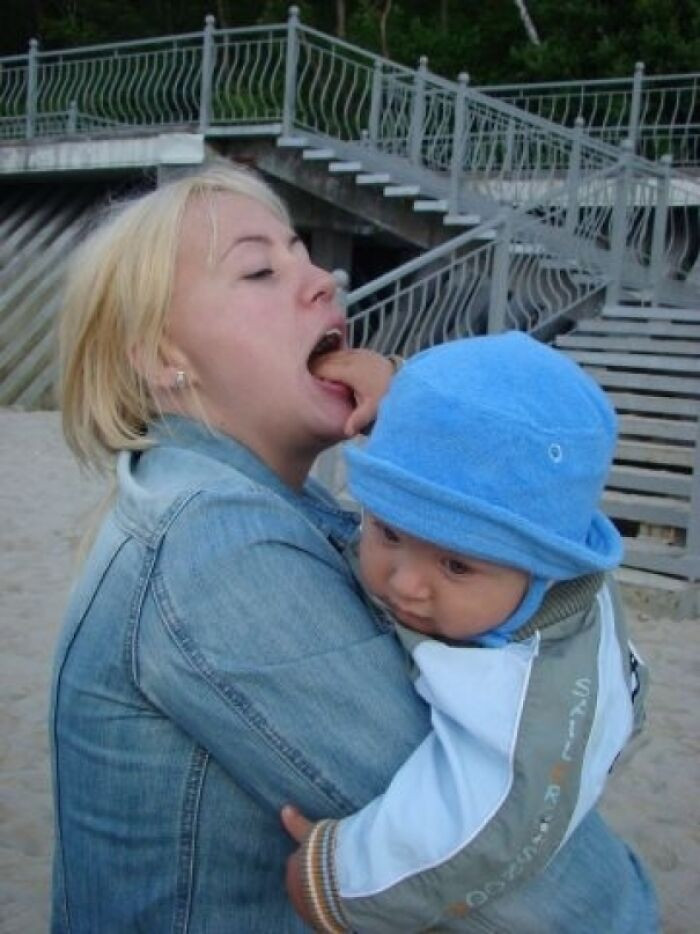 10. Woman Licking Baby's Head