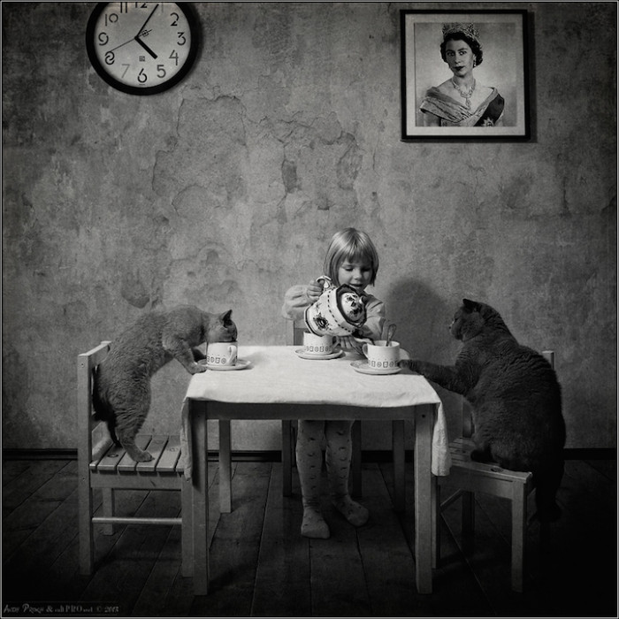 Katherine having a tea party with her kitties