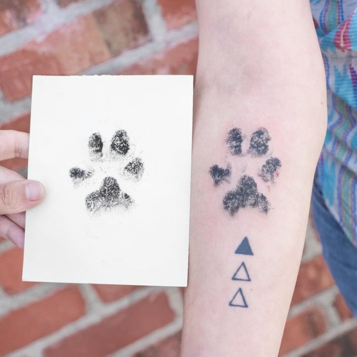 6. Paw tattoo on the forearm