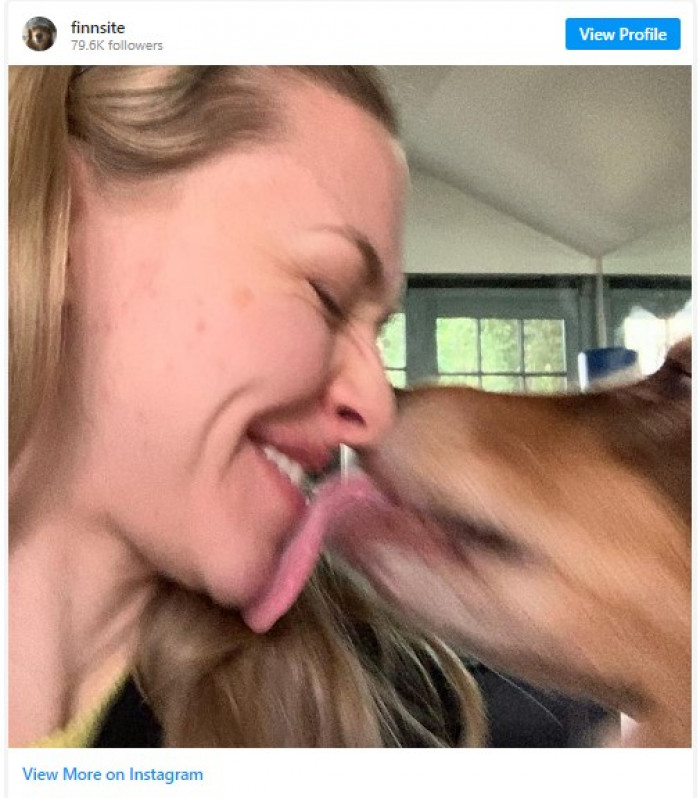 16. Finn gives Amanda Seyfried a big kiss.