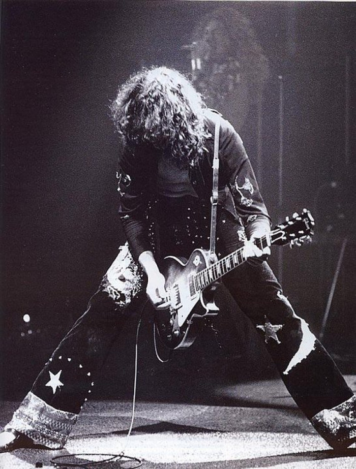 Led Zeppelin's founder, Jimmy Page, performing with the group in the 1970's