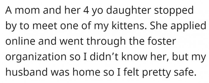 A mother with her child stopped by to meet kittens for adoption.