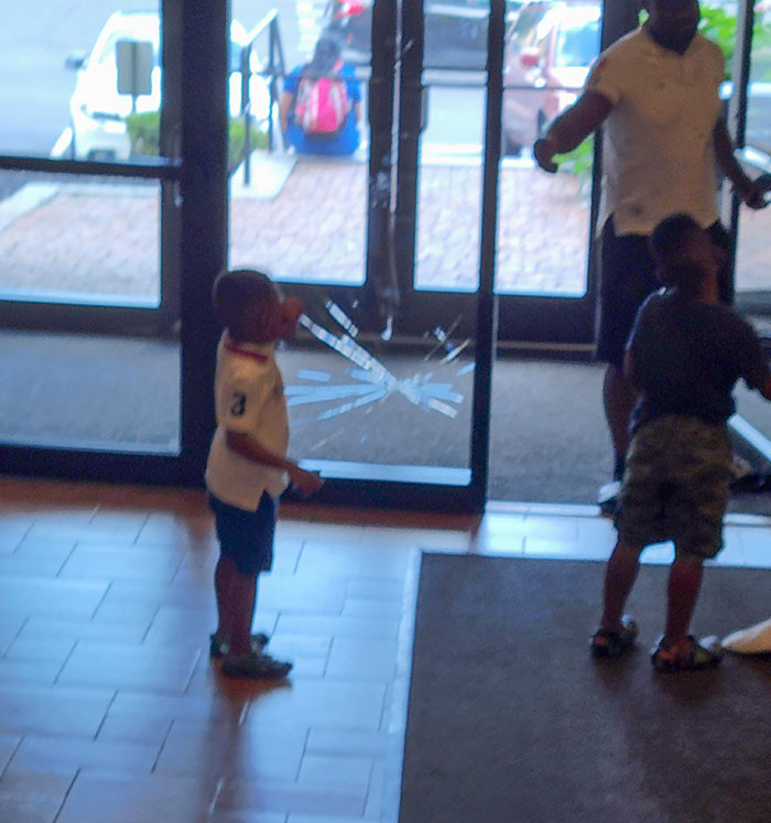 This kid got too excited to see dad, then ran face-first into a glass panel. His head cracked the glass.