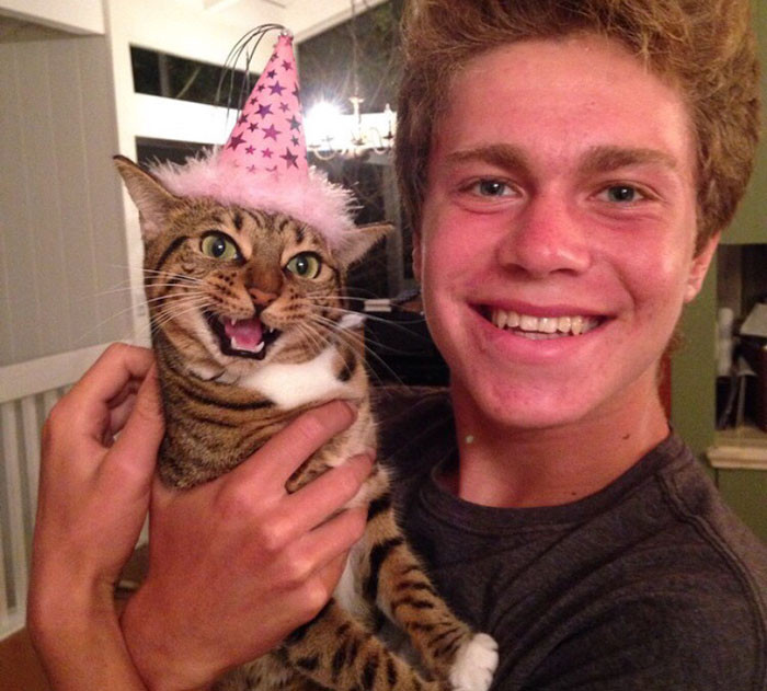 30. “My friend and his cat Nikita on her birthday.”