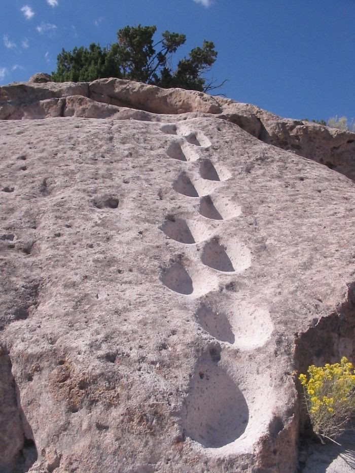 Years of hiking along the volcanic rock at Tsankawi has left hiking imprints.