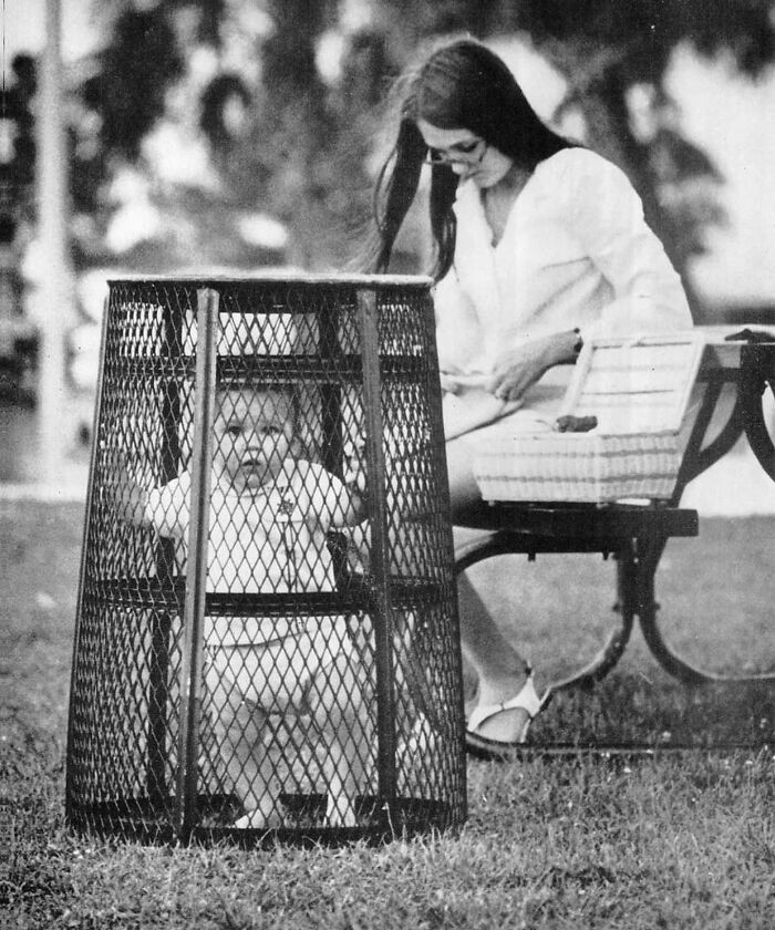 24. A Mom Using A Trash Can To Hold Her Baby While She Crochets In The Park In 1969