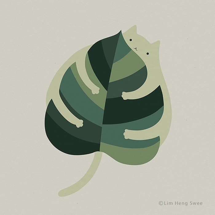 Cat hugging a leaf.