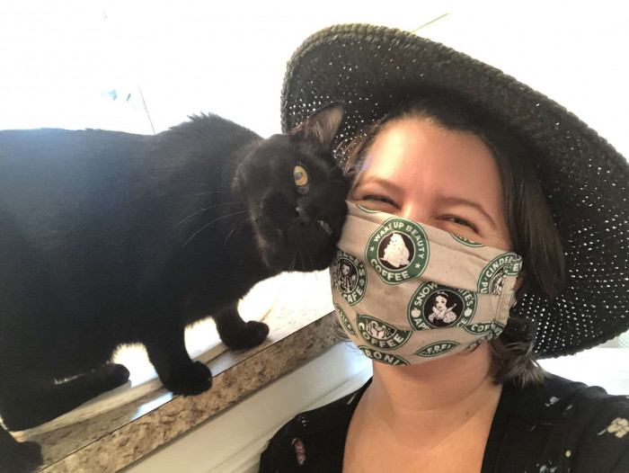Woman searching anxiously for her missing cat near a laundry pile