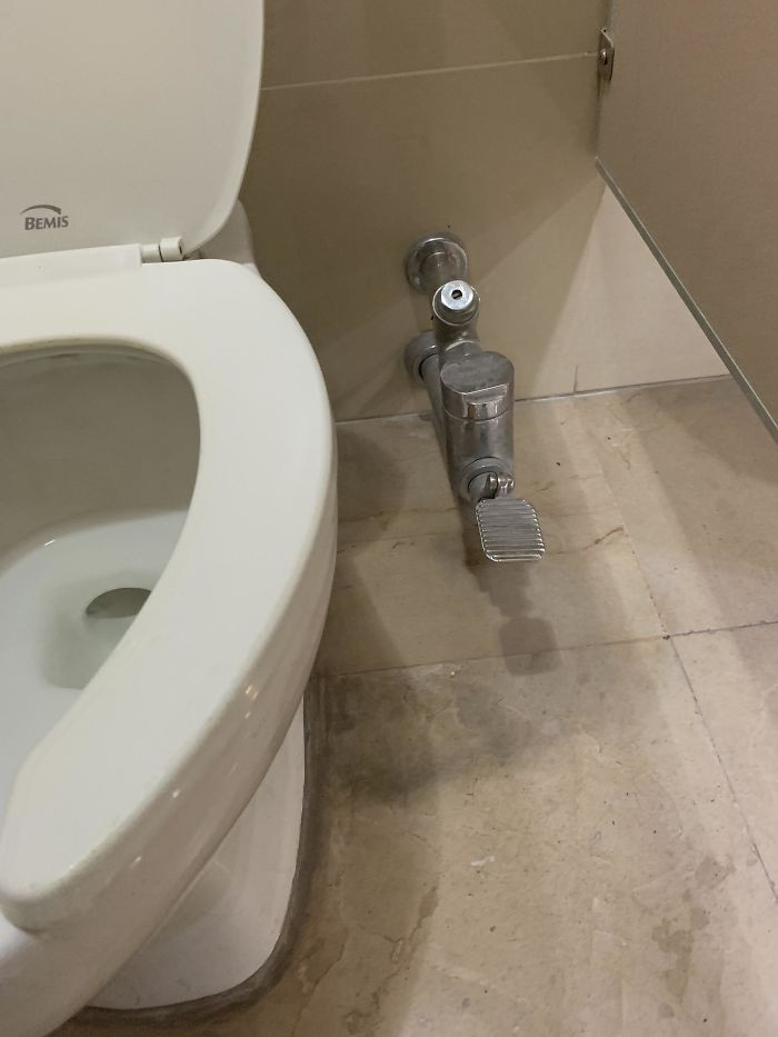 A foot lever for flushing the toilet