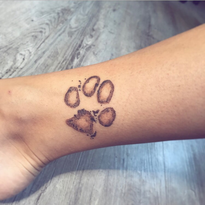 15. Paw tattoo design for ankle