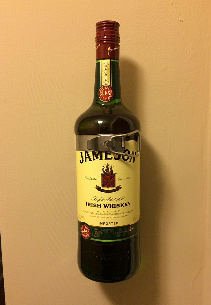 #8 1L bottle of Jameson fits perfectly in fire extinguisher holder