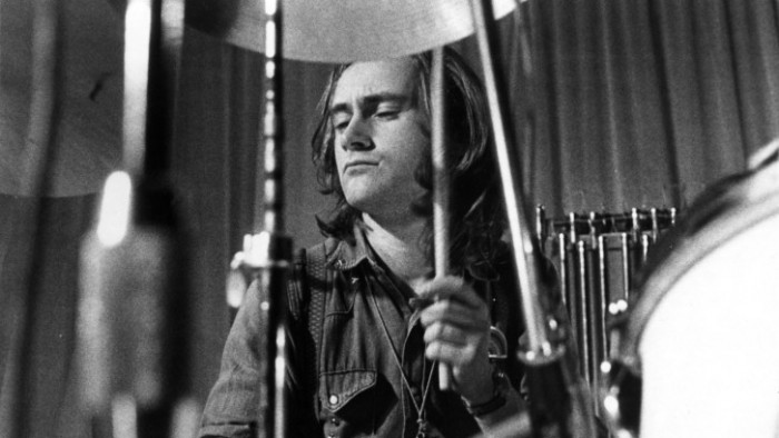 A photo of Phil Collins playing with his band Genesis in the 1970's
