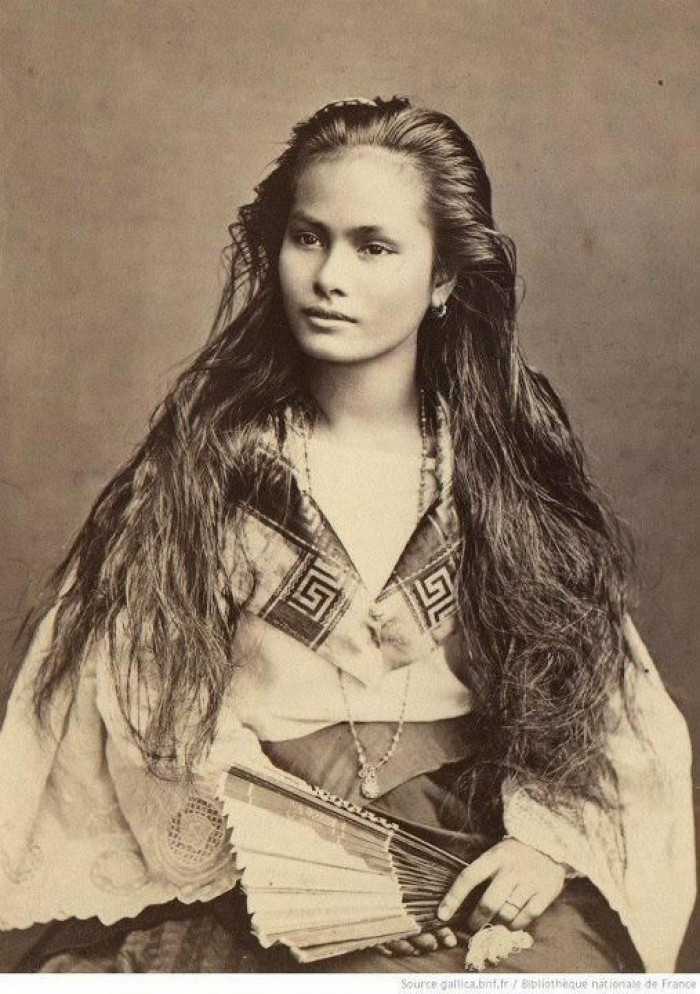 This photograph is of a Mestiza de Sangley woman in 1875