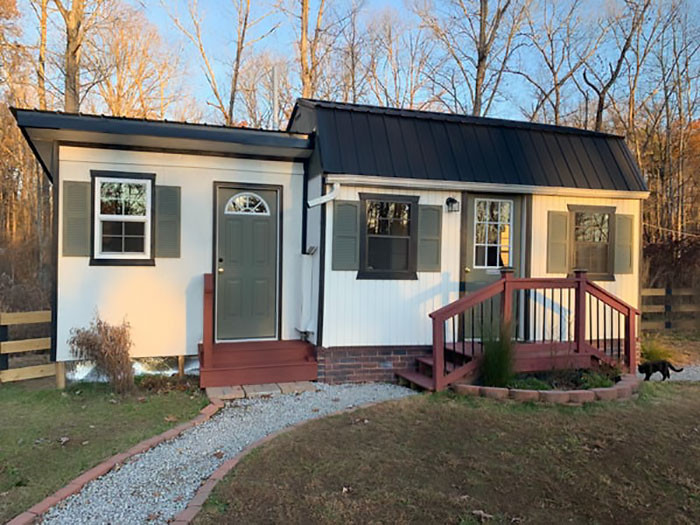 The kids go outdoors and use one of these two public restrooms.