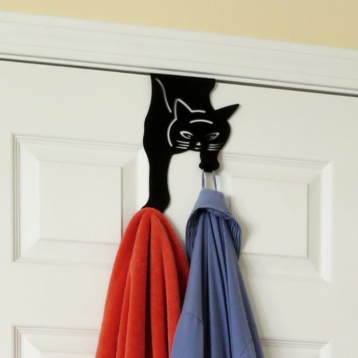 A cat-shaped over-the-door hanger that won't last long because your cat will knock it down within the first few hours.