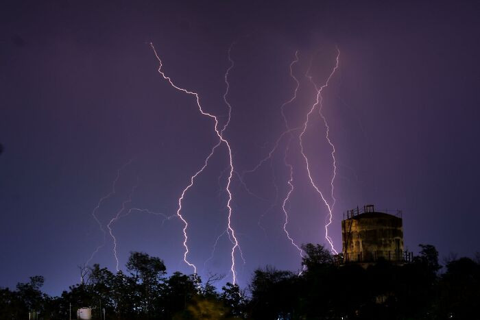 A lightning struck a tower, just right after a radio system specialist decided to leave when he felt something odd as soon as he could no longer hear the birds chirping.