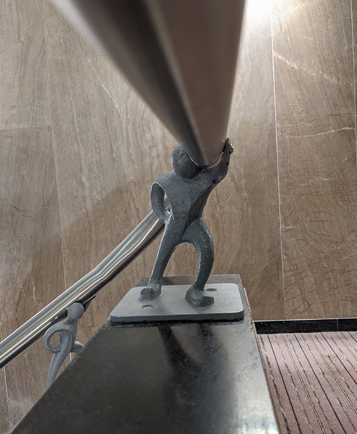 42. The hotel banisters were supported by these little metal men