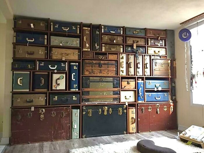 3. Old suitcases and trunks on custom shelves are a great way to store items