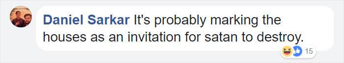 Curious squirrel holding or carrying a small bouquet, near a doorstep