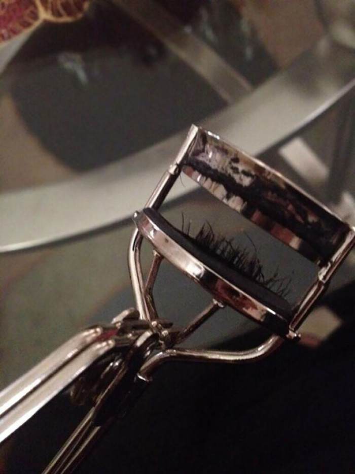 My friend was curling her eyelashes while walking and tripped. This happened:
