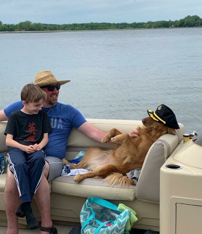 15. "This Little Lady Wasn't Even Ours.. She Jumped Into Our Boat From Another. She Got Trevor To Rub Her Belly And Me To Give Up My Captain's Hat In Under A Minute. Who Doesn't Love Dogs?!?"