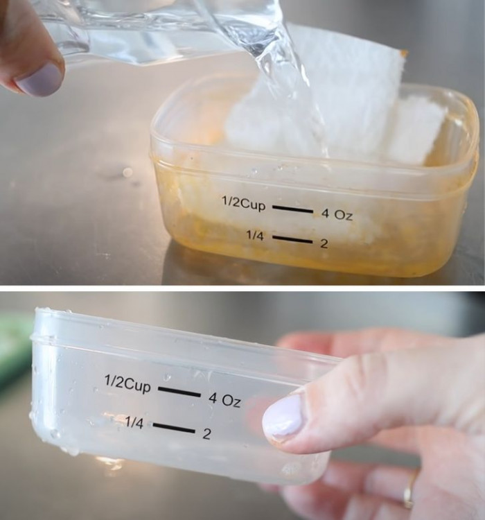 Paper towels for oil stains from a plastic container.