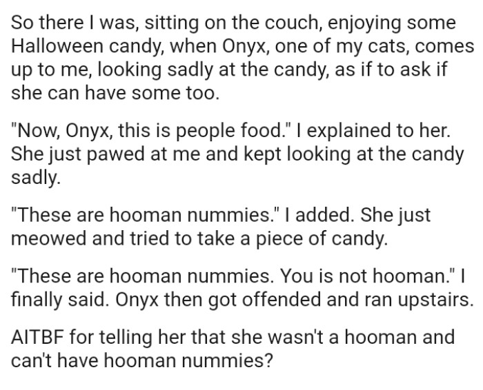 OP's cat comes up to her looking sadly at the candy, as if to ask if she can have some too
