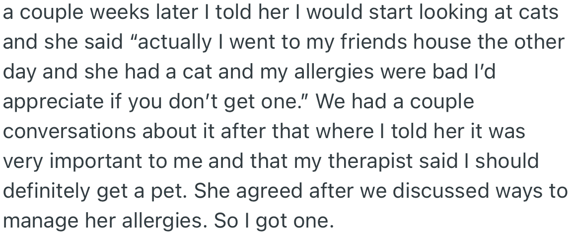 On moving in, OP started looking at cats and informed his new roommate who told him she was allergic to them. They both discussed this, and the roommate agreed for OP to get a cat.