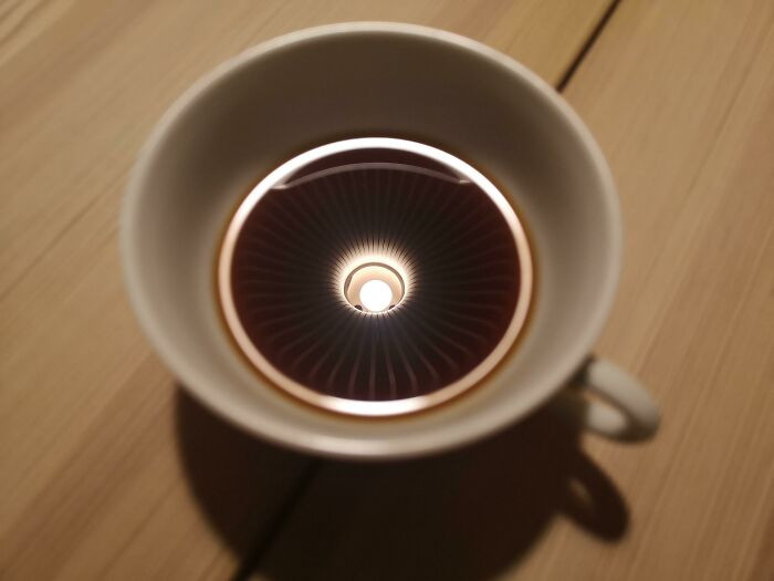 40. ITAP Of My Coffee Cup With The Reflection Of A Lamp