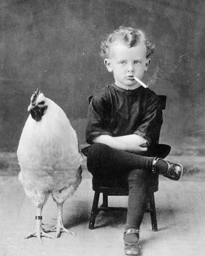 "A boy and his chicken, 1910."