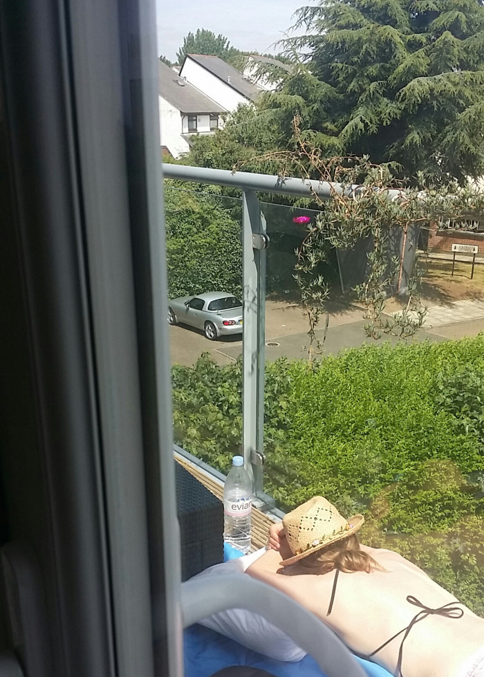 25. My wife doesn't know I'm working from home today. This is my wife, working on her novel. Expected release date: 2052.